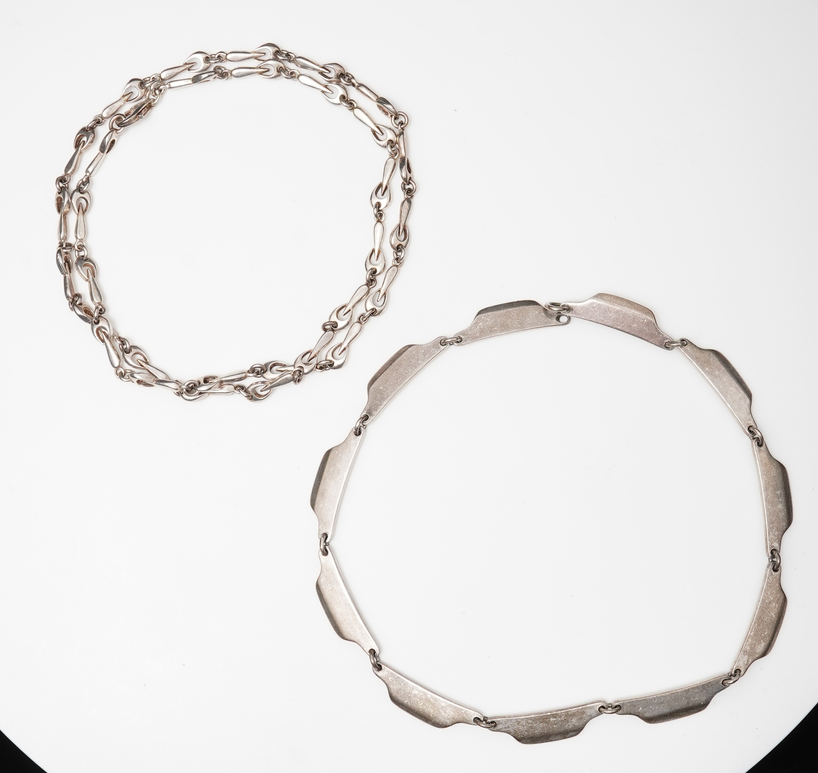 Bent Knudsen, a modernist silver necklace, Denmark, circa 1968, and a silver chain necklace